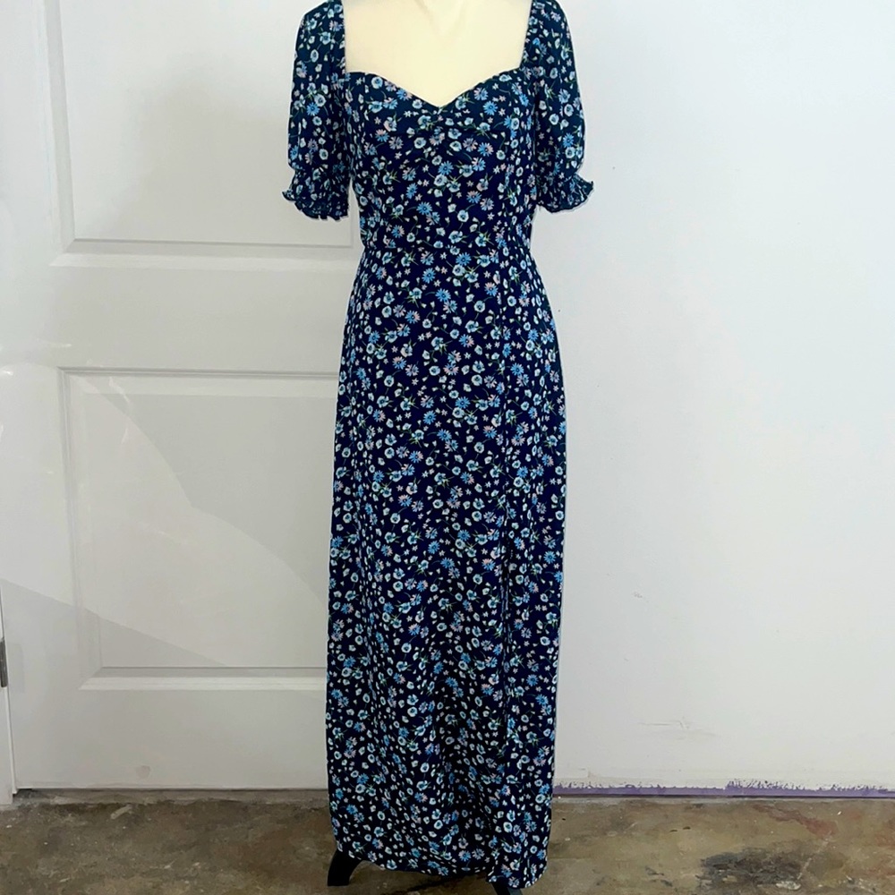 RowA floral Dress has a slit on side elastic on hands and around the shoulder